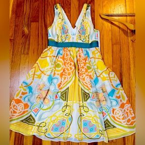 Nicole Miller silk size 4 dress. Very Good condition. Side zip. Low cut.